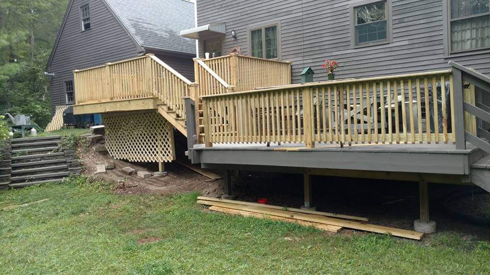 After — completed wood deck and railing in Sutton, MA