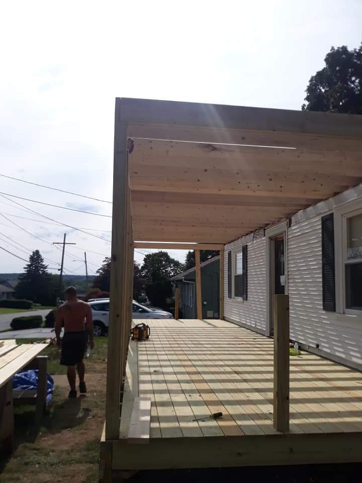 Before — porch floor joists during deck construction in Worcester County, MA