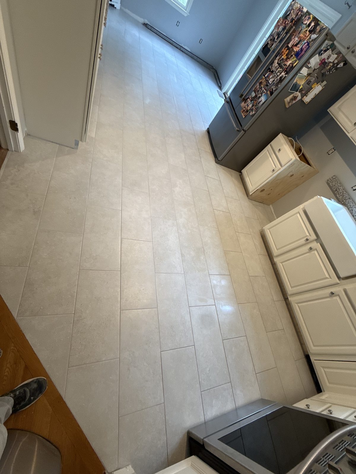 After — tile flooring through a Sutton, MA kitchen