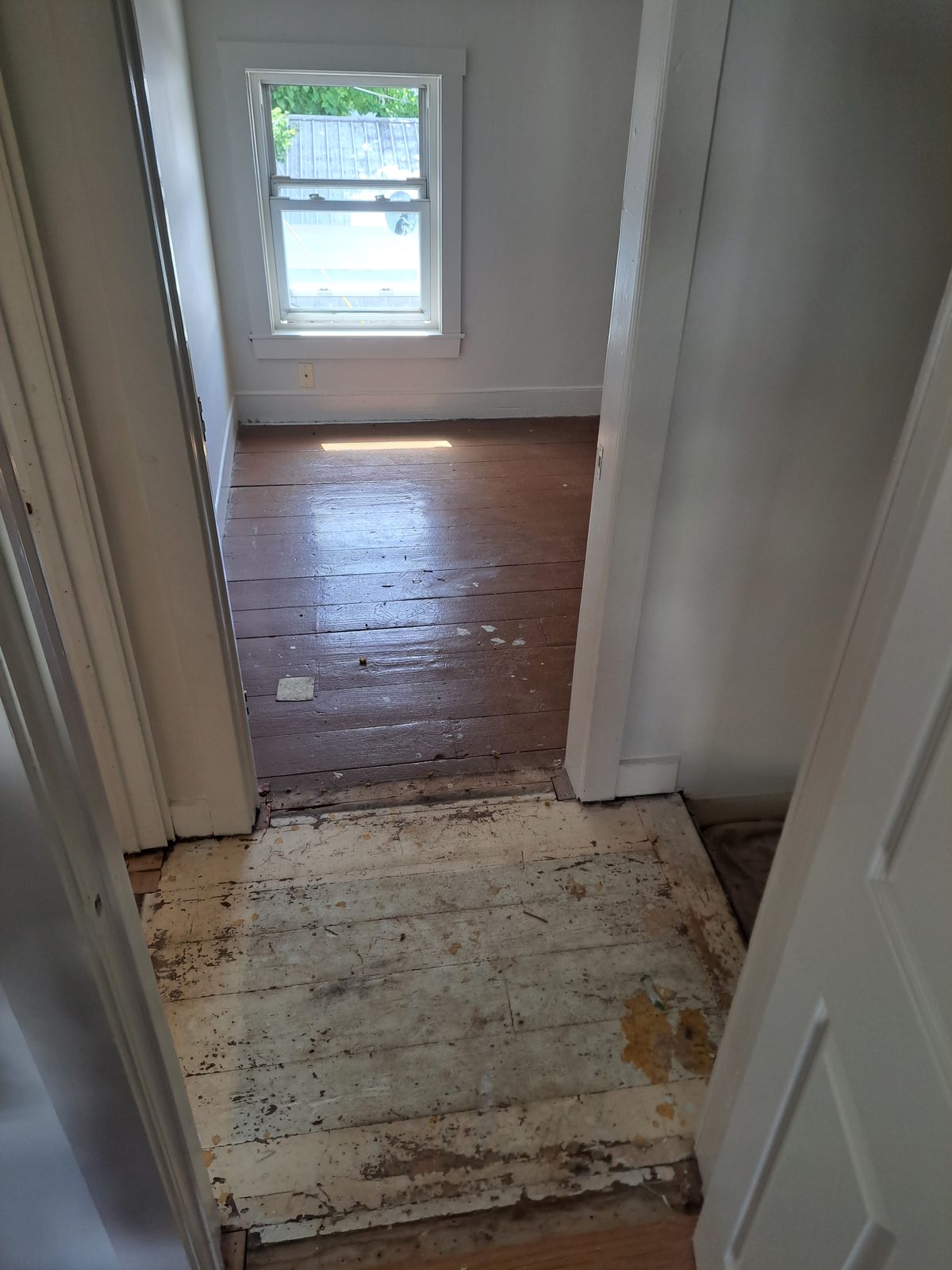 Before — worn painted wood floors prior to floor work in Sutton, MA