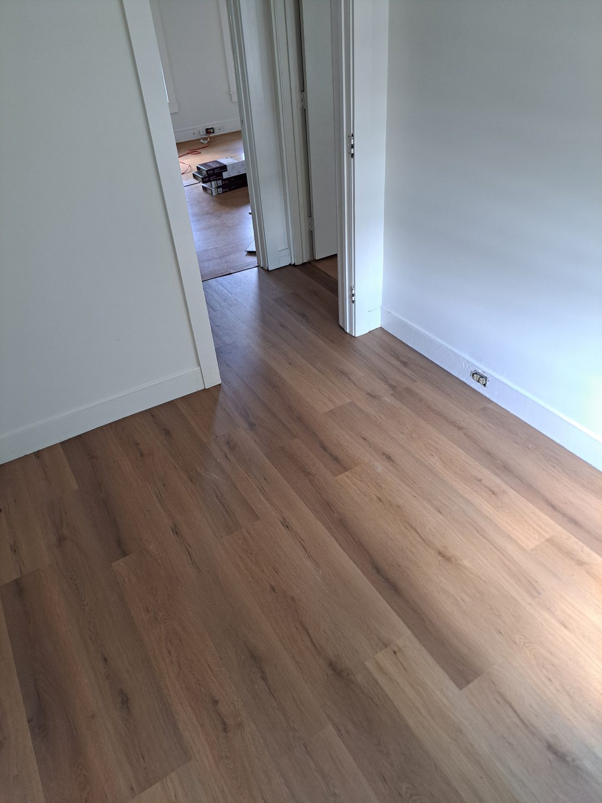 After — plank flooring through a hallway by general contractor Sutton, MA