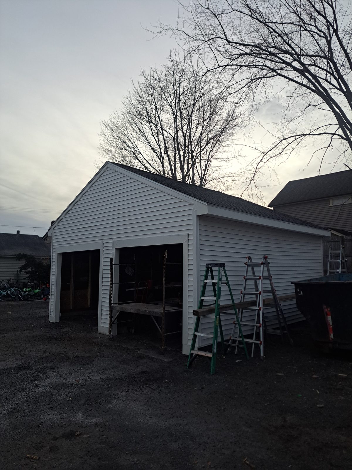 After — two-bay garage with new siding in Sutton, MA