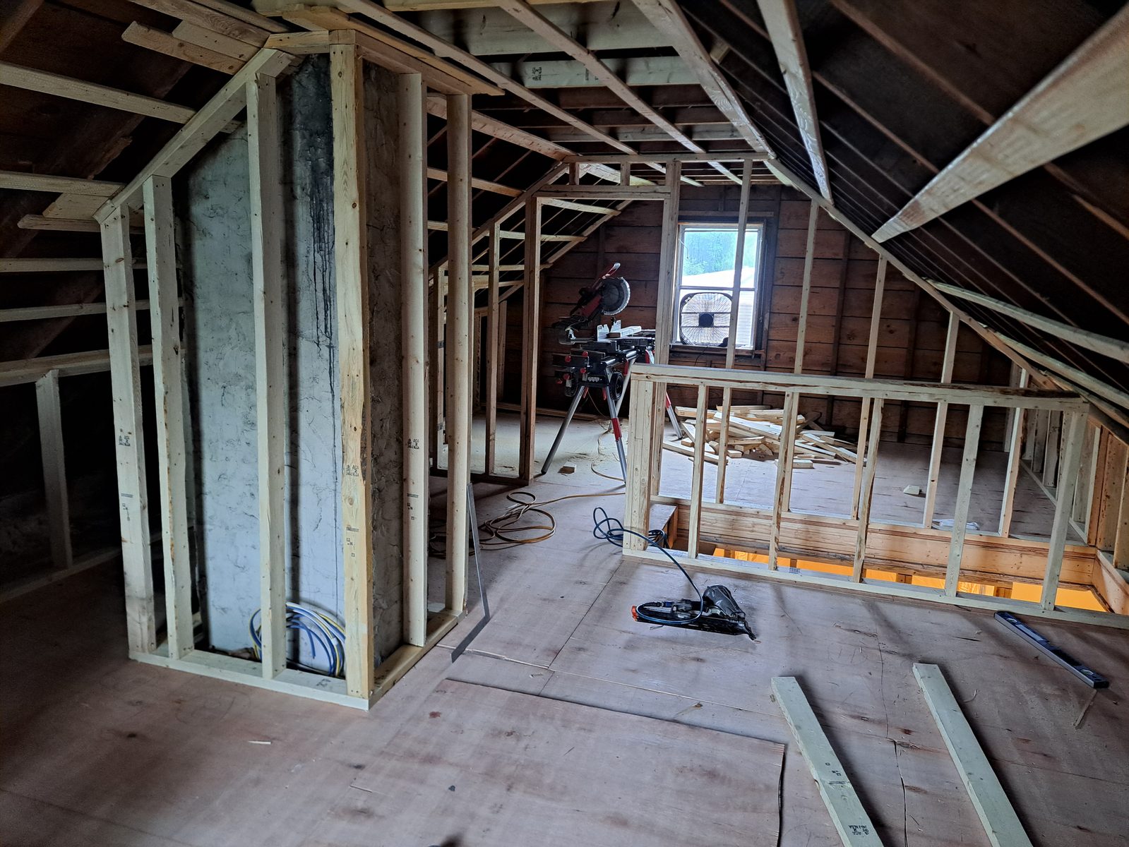 Before — attic wall studs during interior remodeling in Sutton, MA