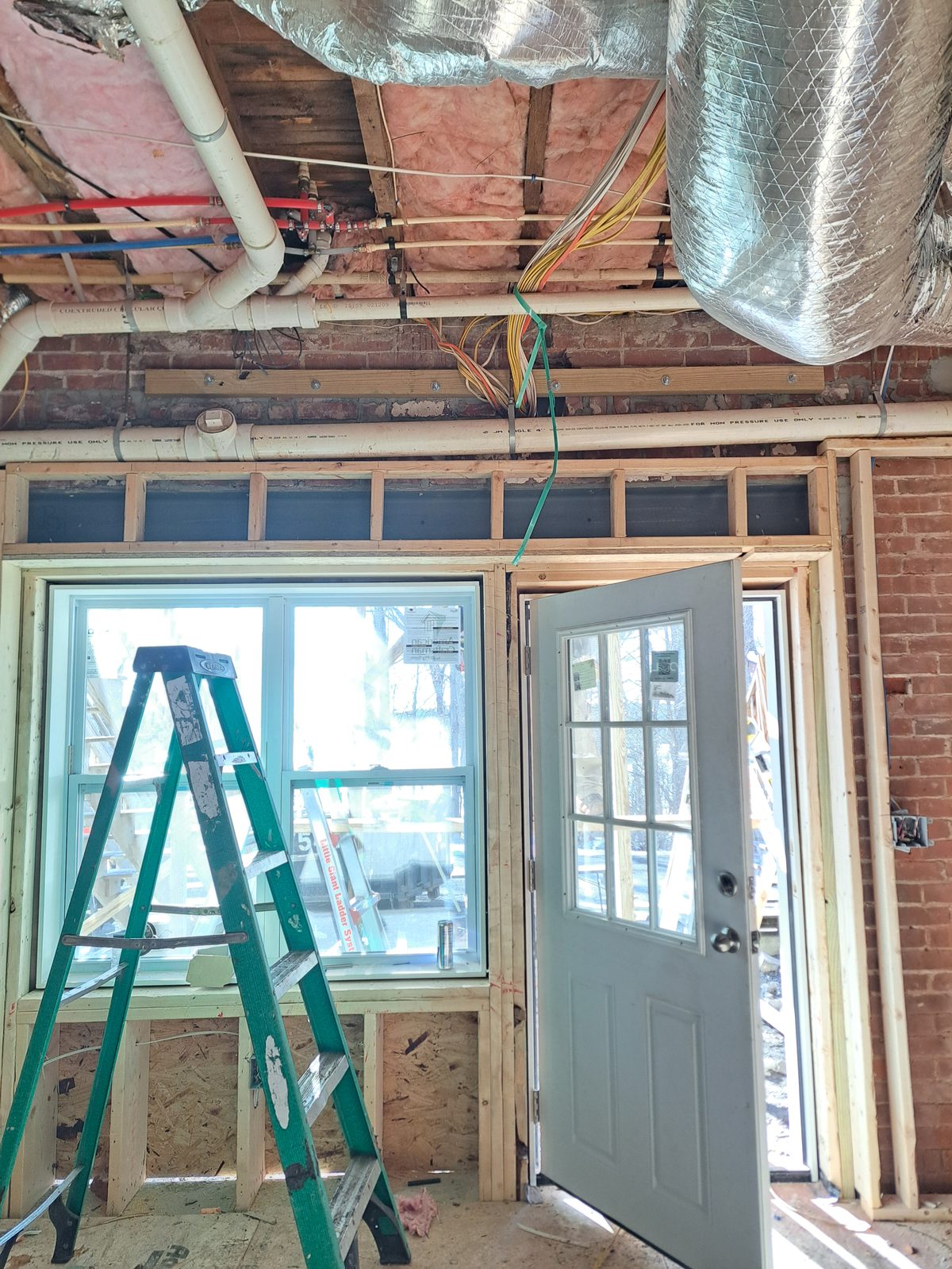 Before — attic window framing during interior remodeling in Sutton, MA