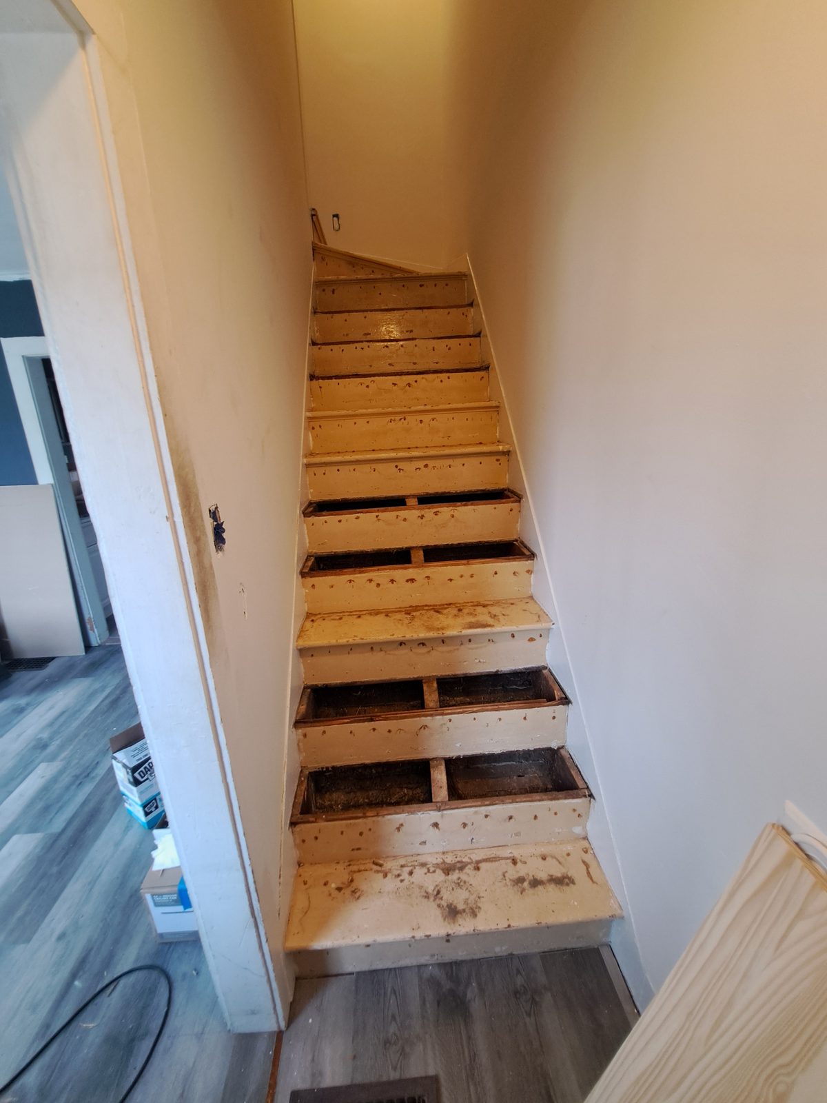 Before — stairwell carpentry during a Sutton, MA remodel