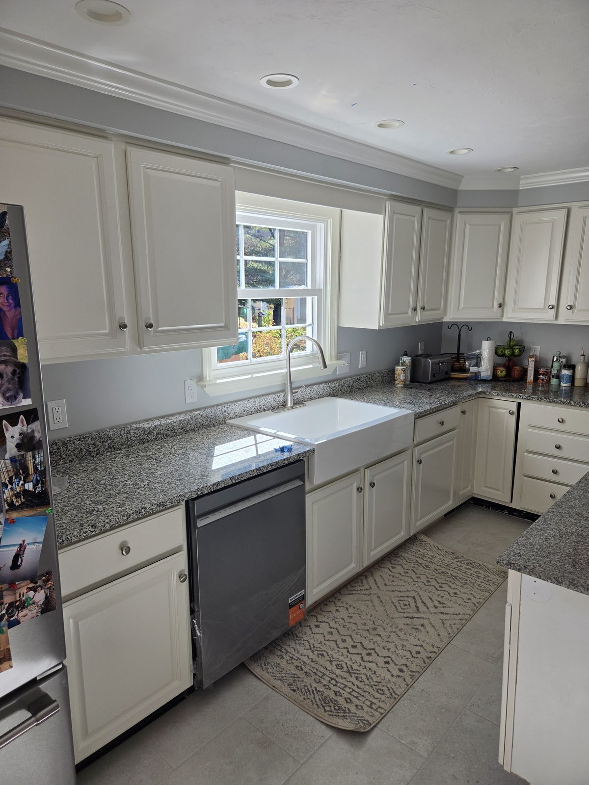 After — dishwasher, farmhouse sink, and granite counters in a Sutton, MA kitchen