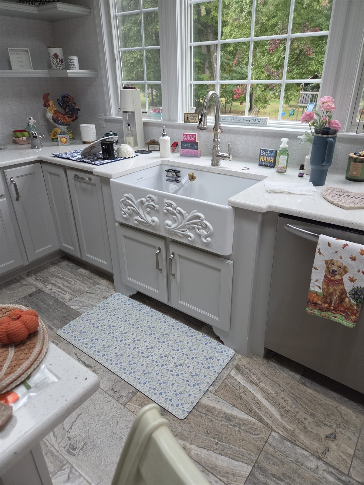 After — finished kitchen with a farmhouse sink and new cabinets in Sutton, MA