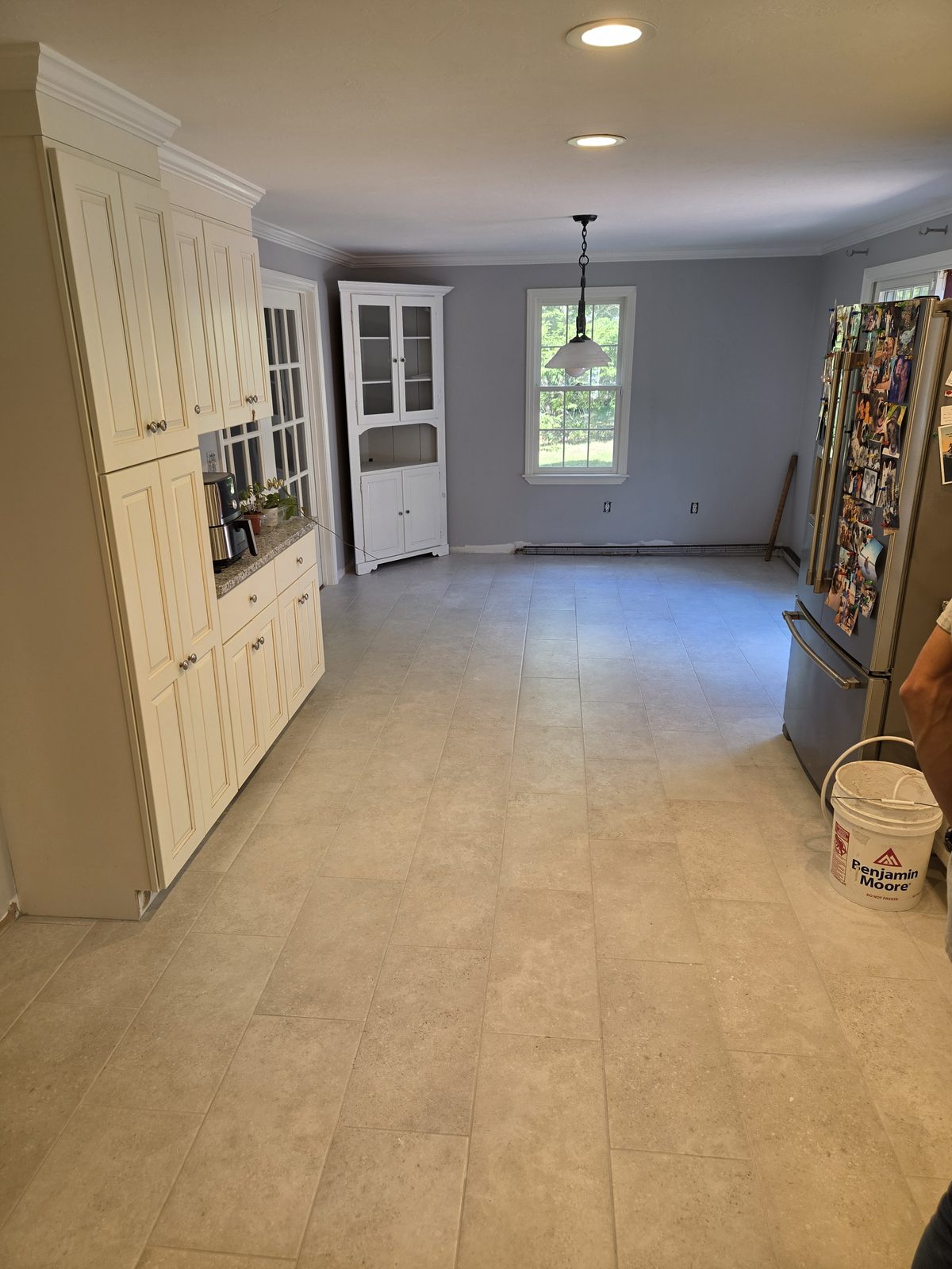 After — pantry cabinets and new tile flooring in a Sutton, MA kitchen