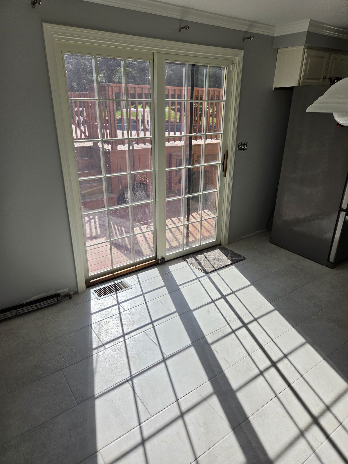 After — French patio doors and tile flooring in a Sutton, MA kitchen