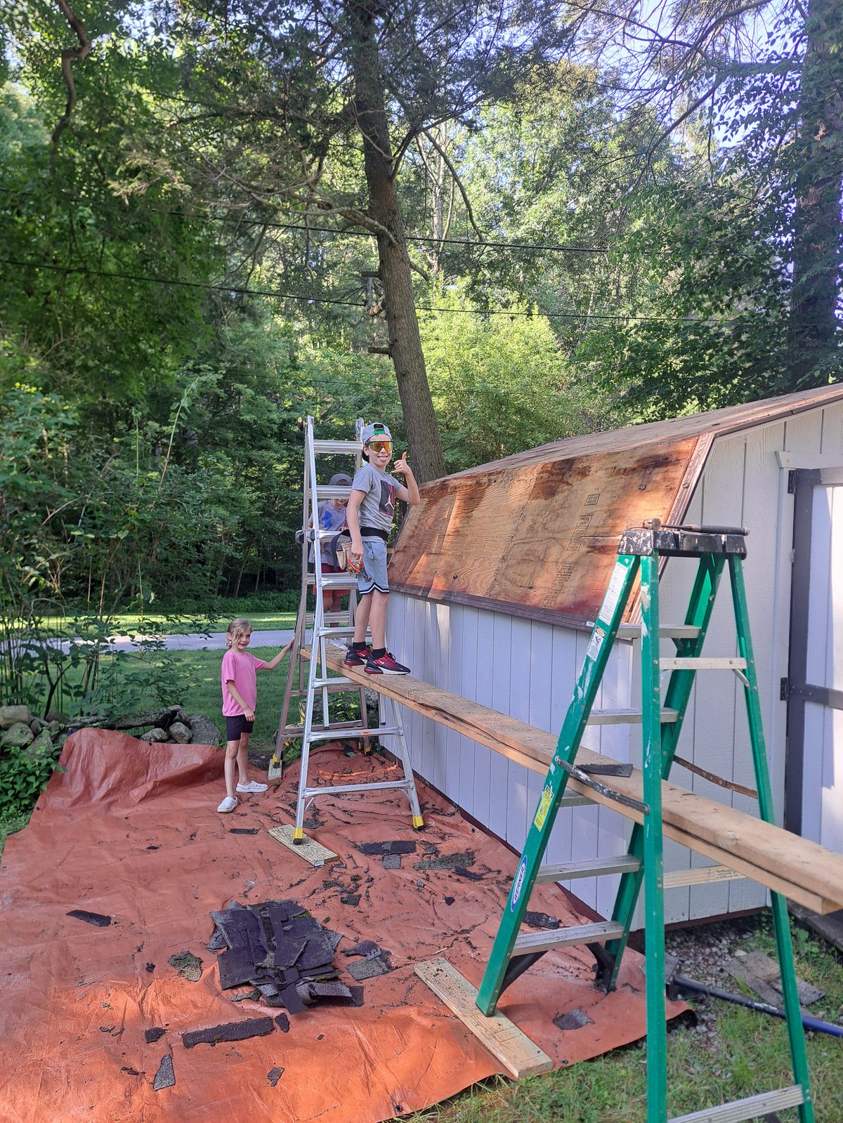 Before — shed shingle removal during roofing in Sutton, MA