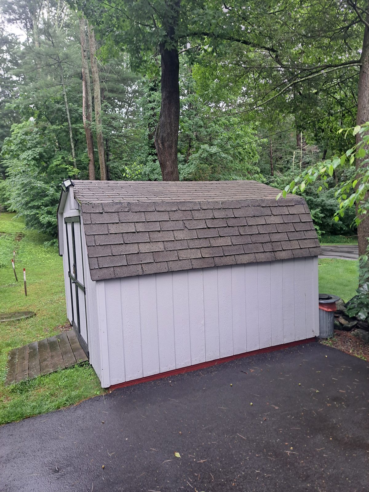 Before — white gable shed before siding and roofing in Sutton, MA