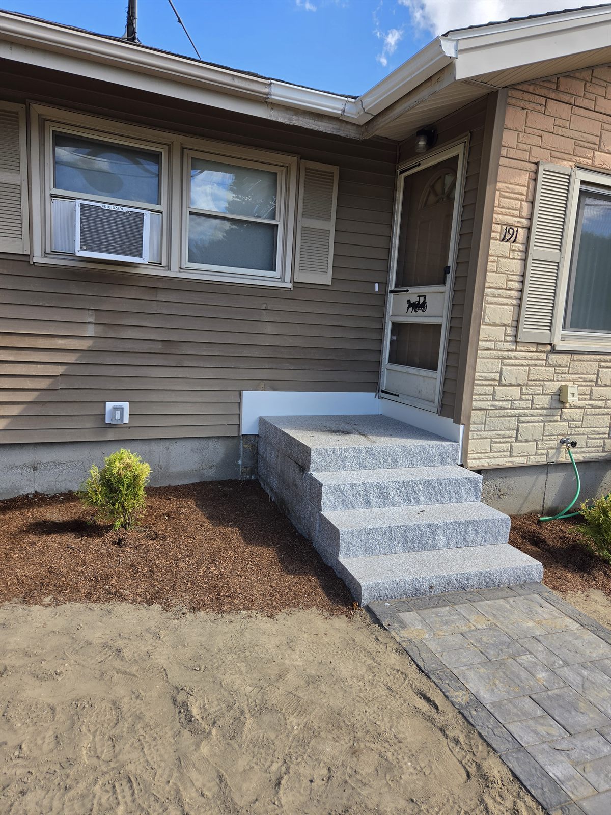 After — new siding and granite entry steps in Sutton, MA